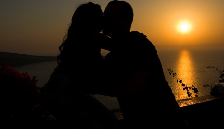 Honeymoon couple kissing